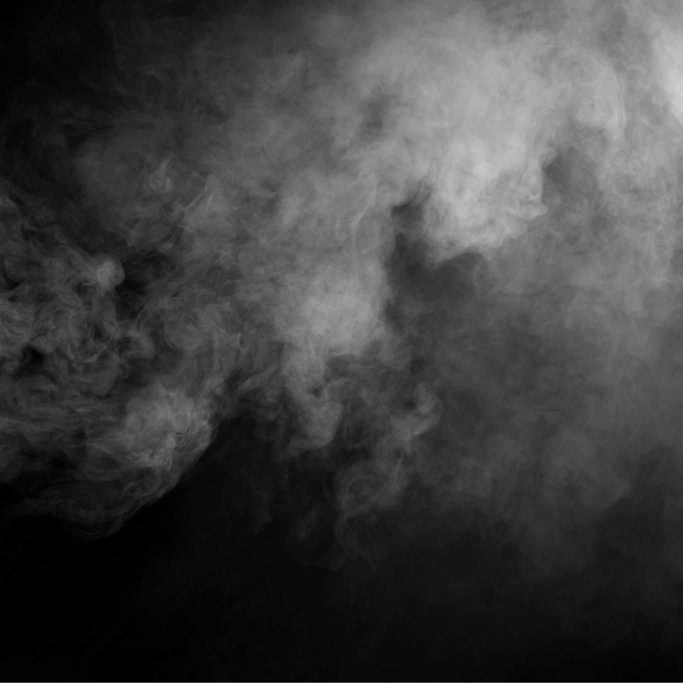 White smoke on black background, creating an ethereal and mysterious effect.